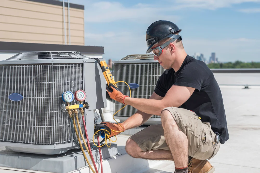 AC service man inspecting