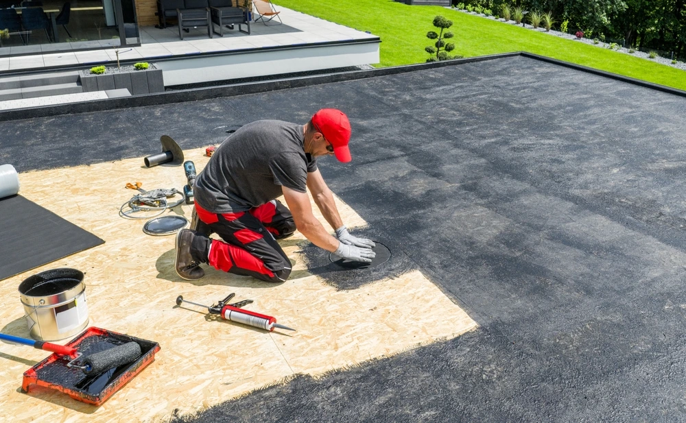 man waterproofing Home roof