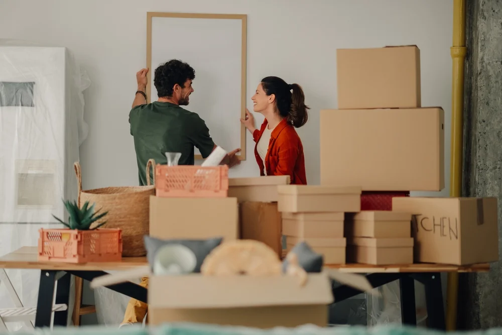 Young couple arranging stuff after reloaction